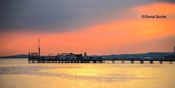 photo of Brighton Palace Pier in the sunset taken from the side from far east by Donal Burke.